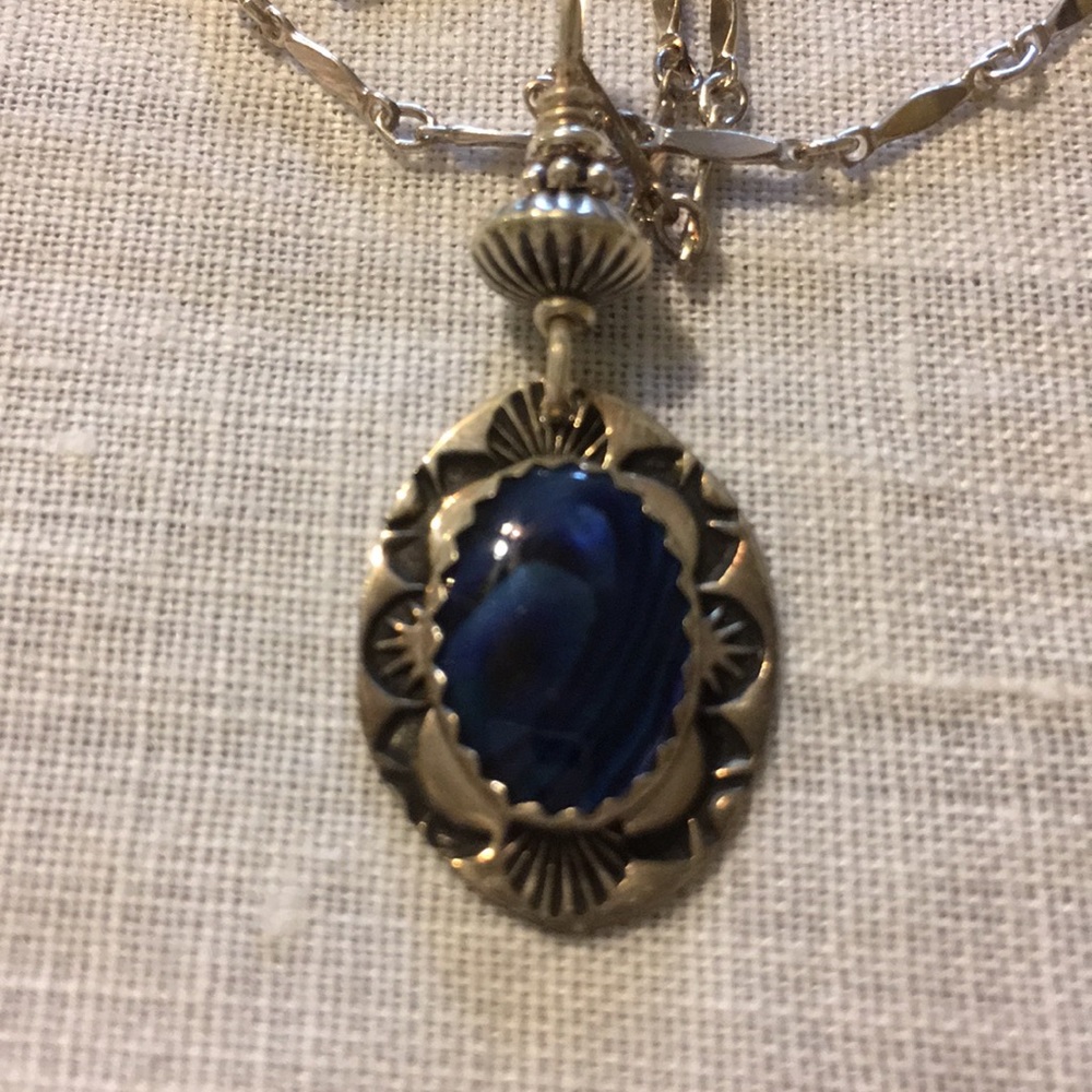 Abalone in silver pendant.  18” chain.